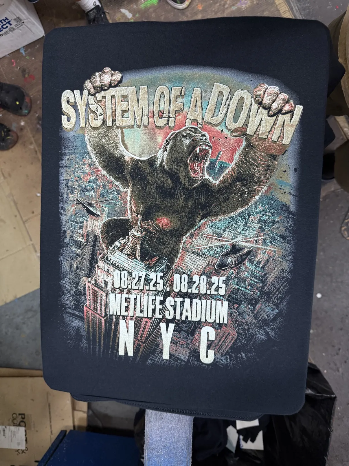 Close-up of the System of a Down stadium tee print