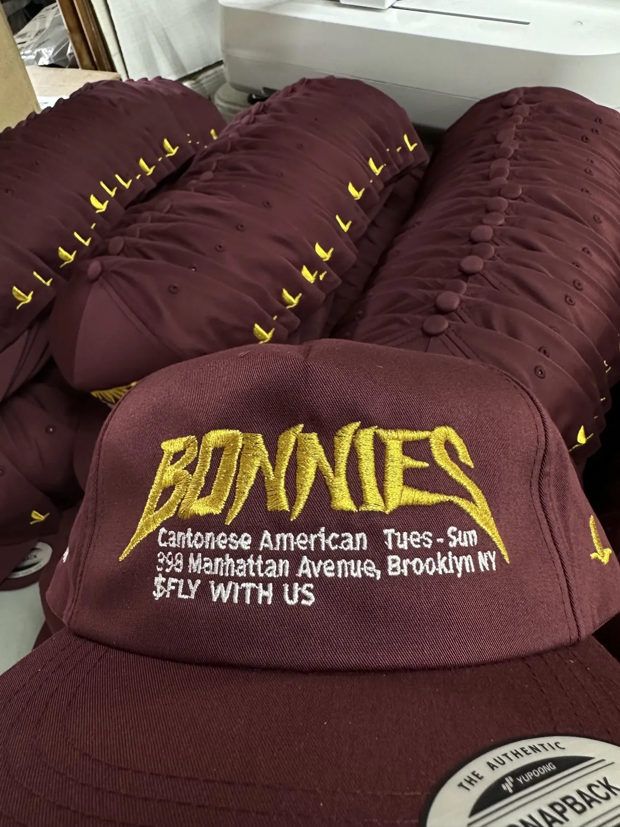 Stack of finished embroidered Bonnie's Brooklyn hats